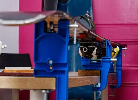 Close up of skis in vises on workbench, set for sharpening. Stock Photos