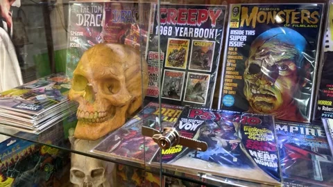 Close-Up of Skull and Horror Comic Display Stock Footage 313357779