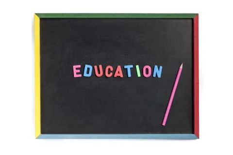 Close up of a slate with plastic alphabets forming education Stock Photos