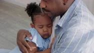 Close Up Sleeping African American Child Dark In Father Arms Stock Footage