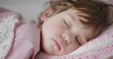 Close-up of sleeping child's face 스톡 동영상 151030150
