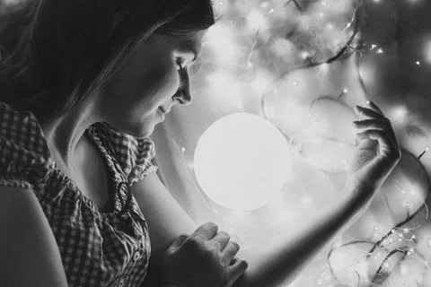Close up sleeping lady with glowing lamp monochrome portrait picture Foto stock
