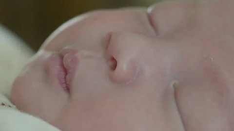 Close-up of a sleeping newborn baby's face Stock Footage 194708883