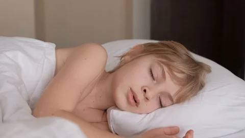 Close up of sleepy child face waking up early in the morning Stock-Footage 125324643