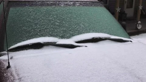 A Close Up of Sleet, Snow, and Ice on a Vehicle While the Precip Falls Stock Footage 157930451