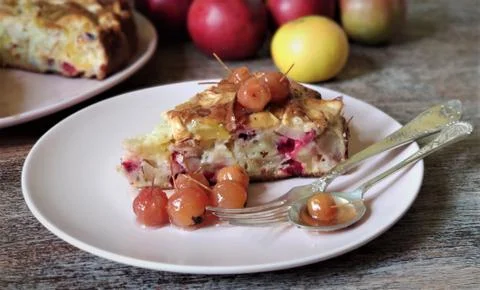 Close-up. A slice of Apple pie and a jam of Paradise apples with a stalk on a Stock Photos