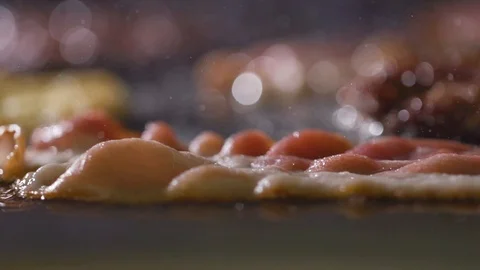 Close-up of a slice of bacon fried on a hot grill Stock Footage 121701876