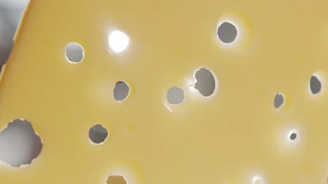 Close-up of slice of cheese with holes falling on board in slow motion Stock Footage 120456336