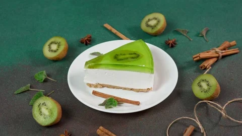 Close up of Slice Cheesecake with Kiwi. Decorated with slice of kiwi Stock Footage 236412816