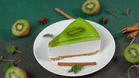 Close up of Slice Cheesecake with Kiwi. Decorated with slice of kiwi Video stock 236412879