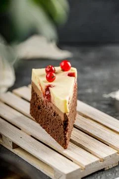 Close up of a slice of delicious cake with red currant and cheesy whipped cream Stock Photos