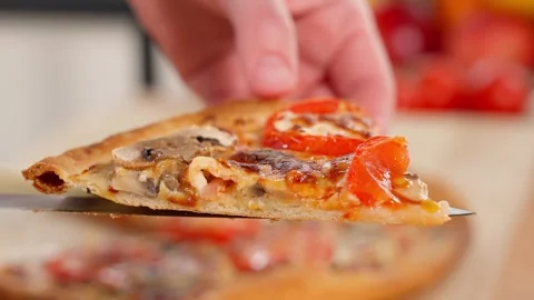 Close-up of a slice of freshly baked pizza. Stock Footage 257698192