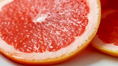 Close up of Slice of Juicy Grapefruit Stock Footage 125397837