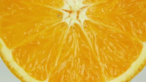 Close up slice of orange rotating. Semicircle of juicy orange Stock-Footage 138717758