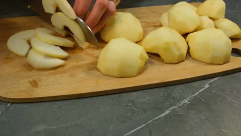 Close up slice the peeled apples for cake recipe on wooden board Stock Footage 199211631
