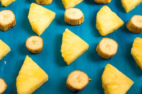 Close up slice pineapple, banana pattern background texture. Stock Photos