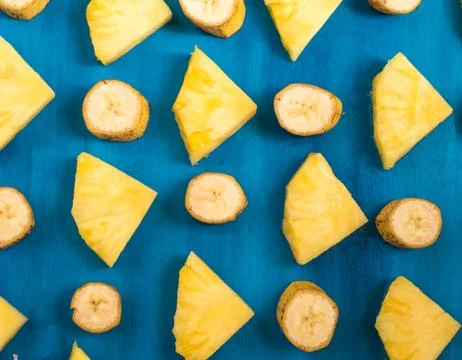 Close up slice pineapple, banana pattern background texture. Stock Photos