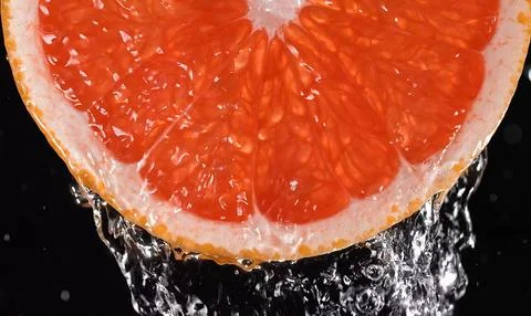 A close-up of a slice of pink grapefruit Stock Photos