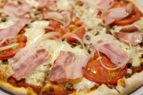 A close up of a slice of pizza Stock Photos