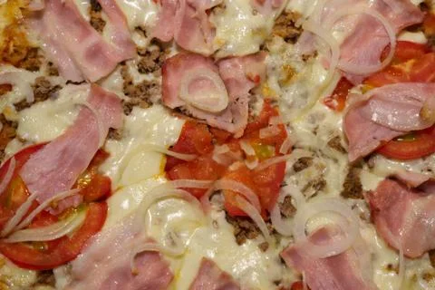 A close up of a slice of pizza Stock Photos