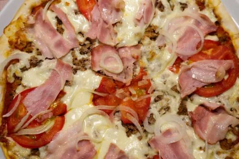 A close up of a slice of pizza Stock Photos