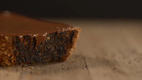 Close Up of Slice of Whole Wheat Bread with Chocolate Spread Stock-Footage 130121729