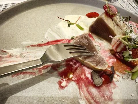 Close up of sliced beef on a fork plus raw vegetables and sweet sauce Stock Photos