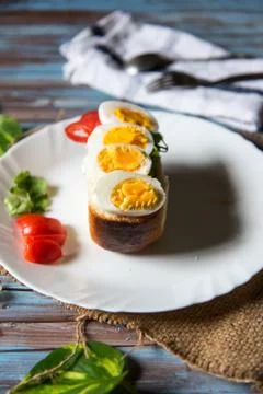 Close up of sliced boiled eggs on bacon Stock Photos