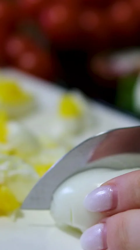 Close-up: Sliced boiled eggs, halves showcasing perfectly cooked yolks nestled Stock Footage 302591249