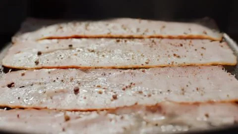 Close-up of sliced bread with seeds in a baking tray Stock Photos