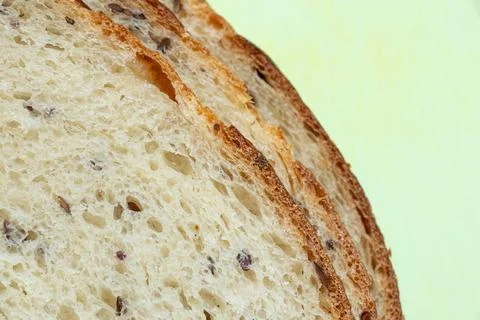 Close-up of sliced bread with seeds. Fresh baked goods with a crispy crust .. Stock Photos