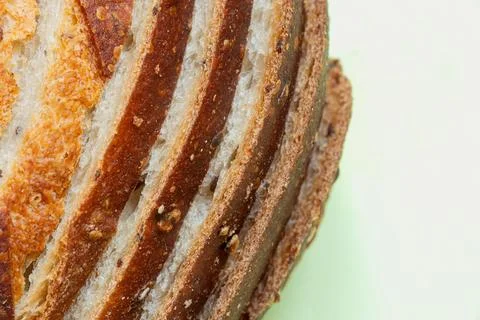 Close-up of sliced bread with seeds. Fresh baked goods with a crispy crust .. Stock Photos