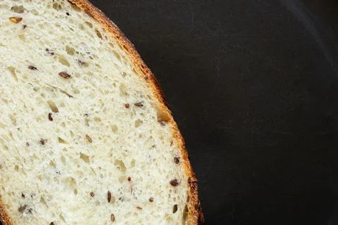 Close-up of sliced bread with seeds. Freshly baked bread with a crispy crust  Stock Photos
