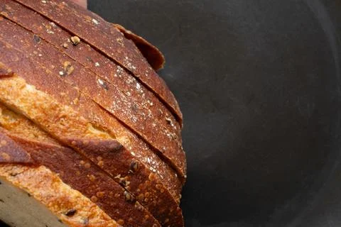 Close-up of sliced bread with seeds. Freshly baked bread with a crispy crust  Stock Photos