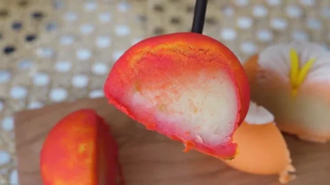 Close-up of Sliced Fruit-Shaped Mochi and Traditional Japanese Wagashi Sweets on Stock Footage 345293611