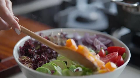Close Up of Sliced Grilled Chicken Being Added to Fresh Salad Stock Footage 336466890