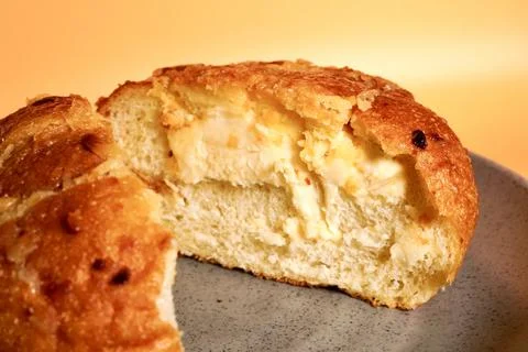 Close up sliced in half garlic cheese bread Stock Photos