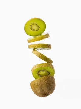 Close up of a sliced kiwi falling Stock Photos