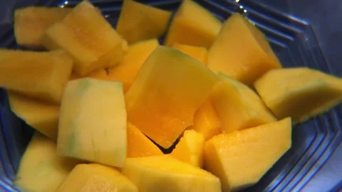 Close up of sliced ​​mango on rotating plate Stock Footage 293767148