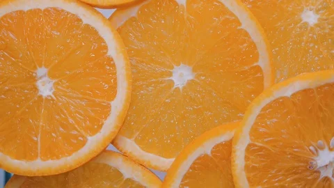 Close up sliced orange fruit  piece , rotation background Stock Footage 101589559