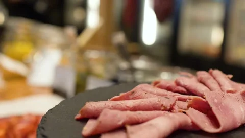 Close Up of Sliced Roast Beef on a Black Slate Platter Stock Footage 333603518