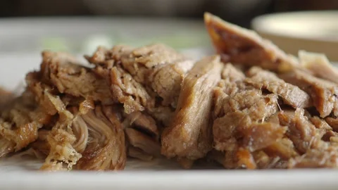 Close-up of Sliced Roasted Meat Being Picked Up with Chopsticks Stock Footage 339259824