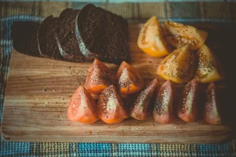Close up sliced rye bread and spicy tomato pieces concept photo 스톡 사진