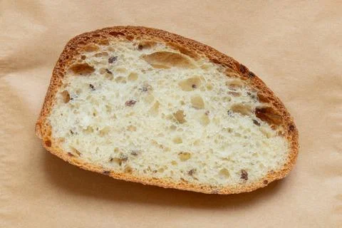 A close-up of sliced seeded bread. Freshly baked, the crisp crust and spongy  Stock Photos