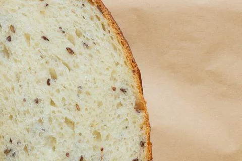 A close-up of sliced seeded bread. Freshly baked, the crisp crust and spongy  Stock Photos