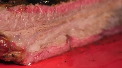 Close-up of Sliced Smoked Beef Brisket with Juicy Texture and Pink Smoke Ring Stock Footage 338212829