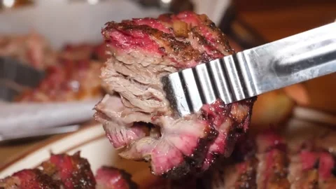 Close-up of Sliced Smoked Beef Brisket with Pink Smoke Ring and Dark Bark Stockbeeldmateriaal 338212866