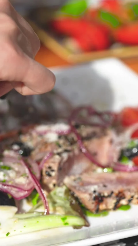 Close up of sliced tagliata beef steak served on a plate in fine dining res.. Stock Footage 339294633