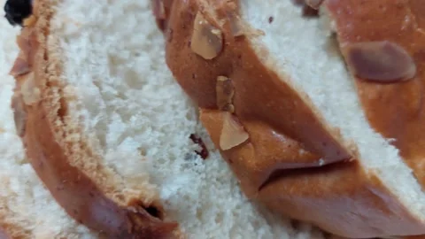 Close up of sliced traditional Czech Easter sweet bread Mazanec with almonds Stock Footage 333641791