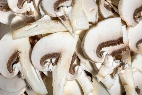 Close up sliced white button mushrooms texture culinary food background Stock Photos